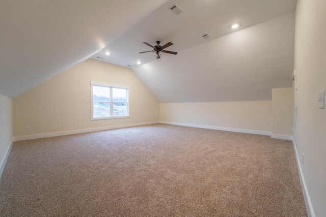 additional living space with vaulted ceiling, ceiling fan, and carpet flooring