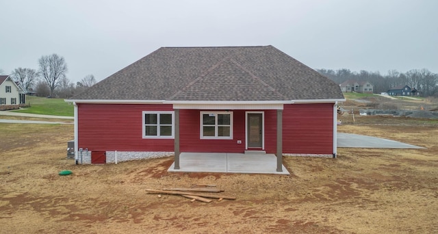 back of house with a patio