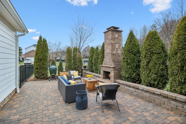 view of patio / terrace featuring an outdoor living space with a fireplace