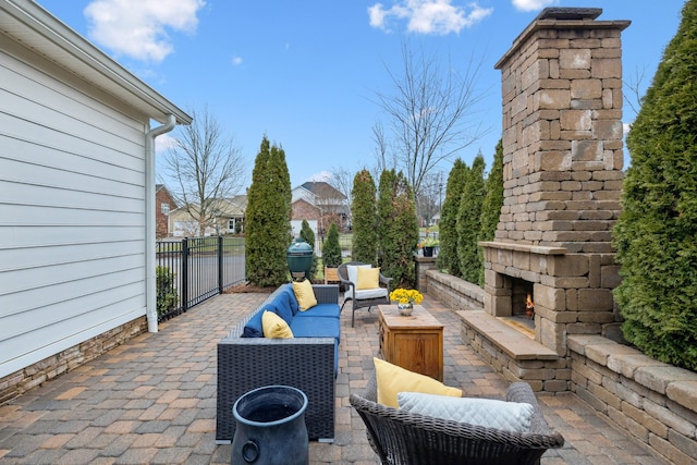 view of patio / terrace featuring an outdoor living space with a fireplace