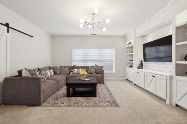 living room featuring built in shelves, a barn door, light carpet, and a notable chandelier