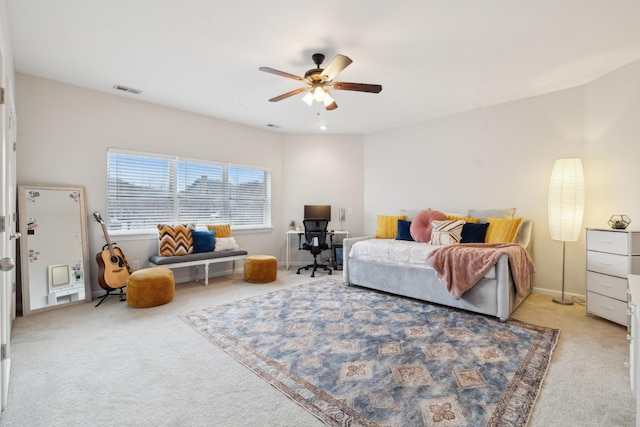 carpeted bedroom with ceiling fan