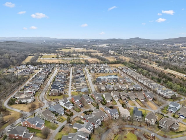 birds eye view of property featuring a mountain view