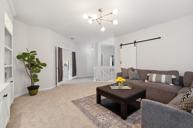 carpeted living room featuring a barn door and an inviting chandelier