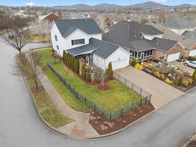 birds eye view of property featuring a mountain view