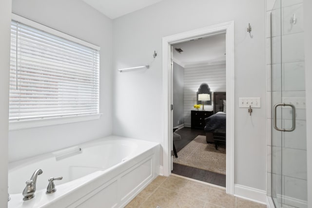 bathroom featuring tile patterned floors and shower with separate bathtub