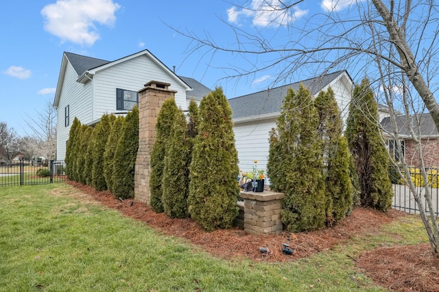 view of property exterior featuring a lawn