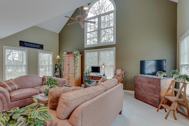 living room with high vaulted ceiling, light colored carpet, and ceiling fan