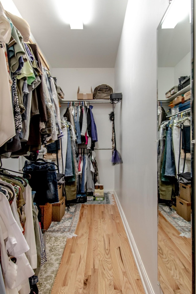 walk in closet featuring hardwood / wood-style floors