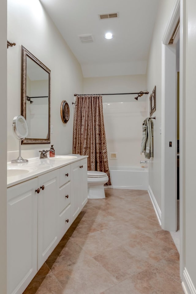 full bathroom with shower / tub combo, vanity, tile patterned floors, and toilet