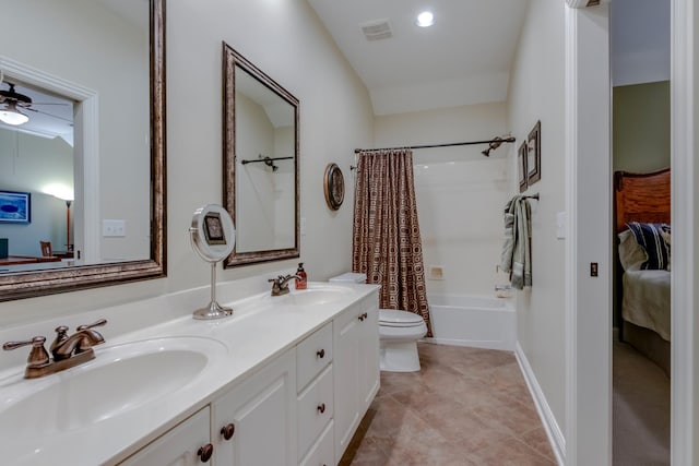 full bathroom with ceiling fan, tile patterned flooring, vanity, toilet, and shower / bath combo with shower curtain