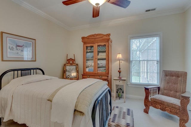 bedroom with crown molding, carpet floors, and ceiling fan