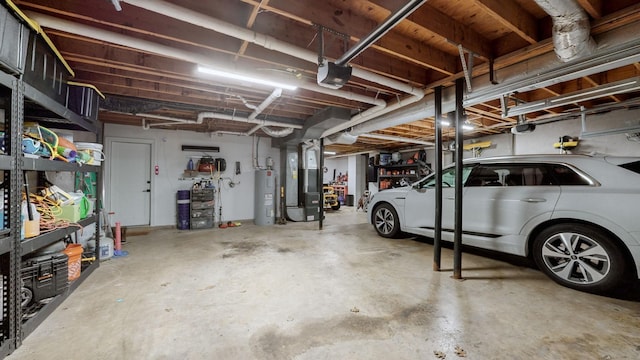 garage featuring water heater, a garage door opener, and heating unit