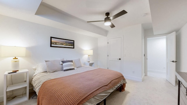 bedroom with ceiling fan and light carpet