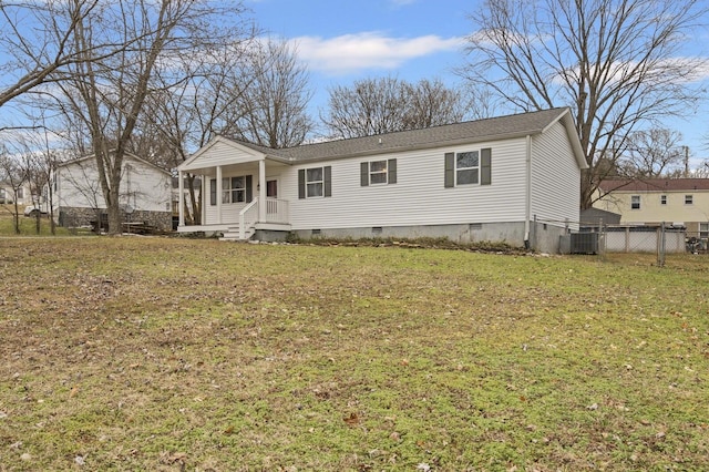 manufactured / mobile home featuring cooling unit and a front lawn