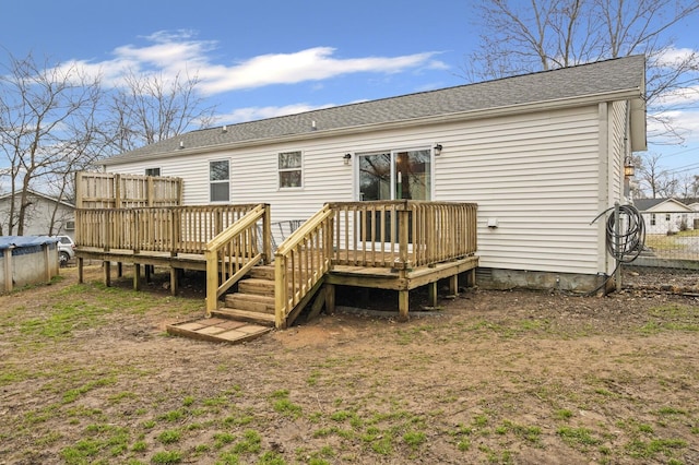 back of property featuring a deck