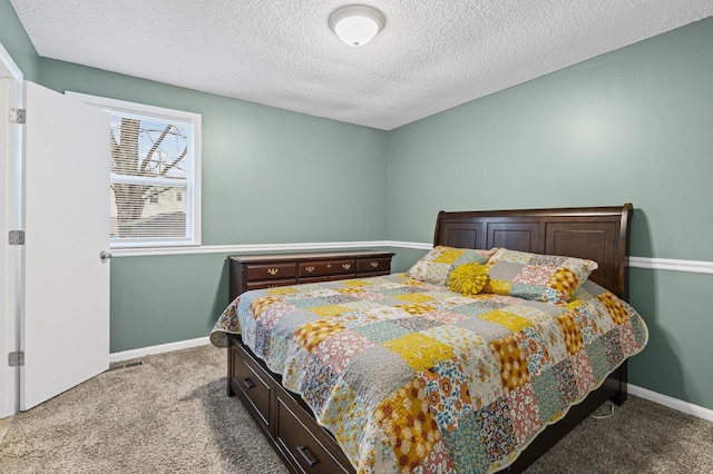 carpeted bedroom with a textured ceiling