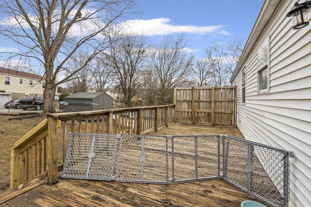 wooden deck featuring a storage shed