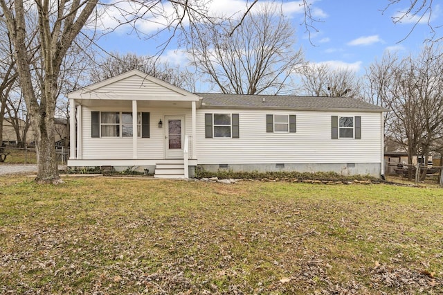 manufactured / mobile home with a front lawn and covered porch