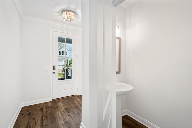 entryway with crown molding and dark hardwood / wood-style floors