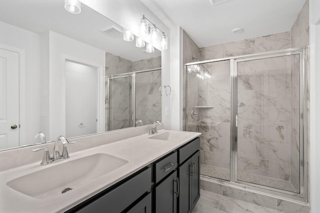 bathroom featuring walk in shower and vanity