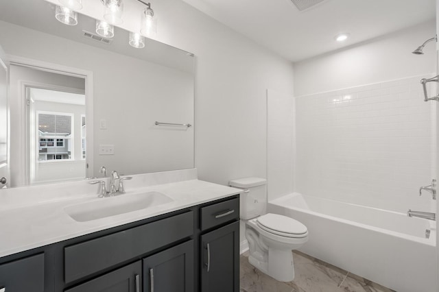 full bathroom featuring vanity, washtub / shower combination, and toilet