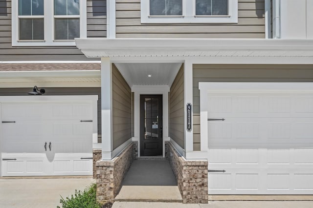 property entrance with a garage