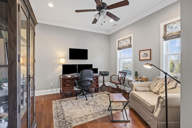 home office with crown molding, dark wood-type flooring, and ceiling fan