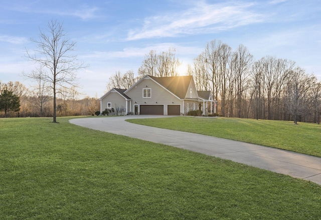 view of front of property featuring a garage and a front yard