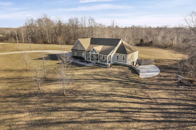 farmhouse inspired home featuring a porch and a front yard