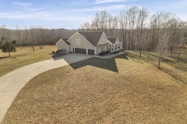 exterior space with a garage and a front lawn