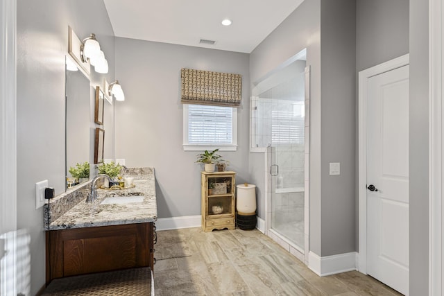 bathroom with walk in shower, vanity, and radiator