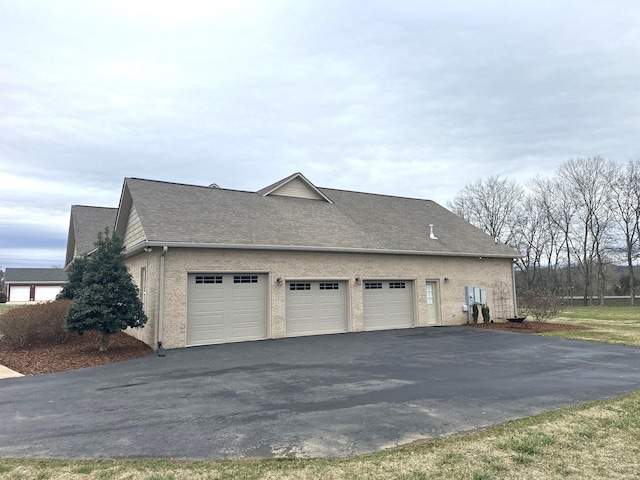 view of side of property featuring a garage