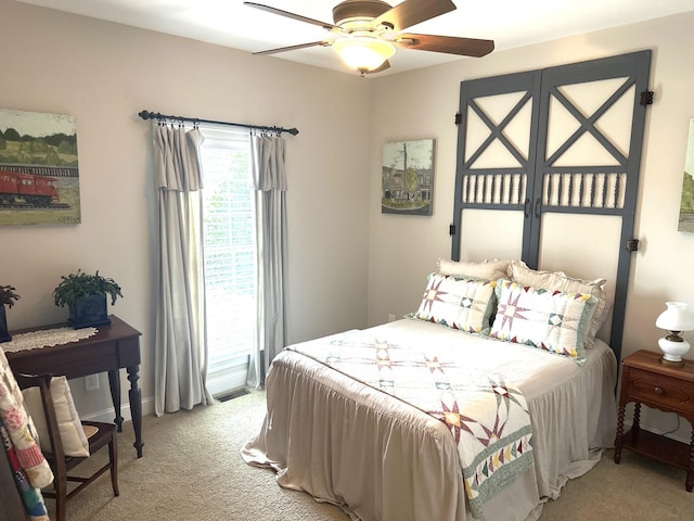 bedroom featuring light carpet and ceiling fan