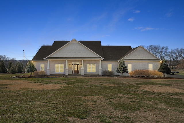 craftsman inspired home with a front yard