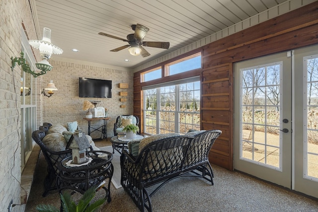 sunroom / solarium with ceiling fan and wood ceiling