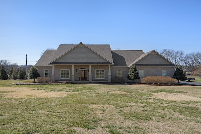 craftsman-style home with a front yard