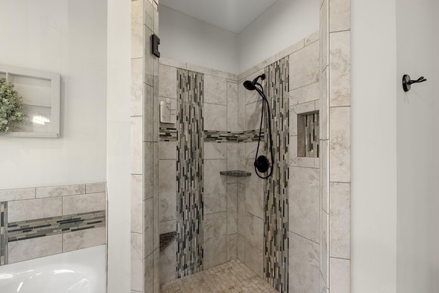 full bathroom featuring a stall shower and a garden tub