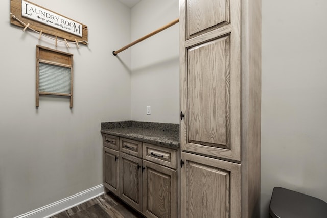 interior space featuring wood finished floors and baseboards