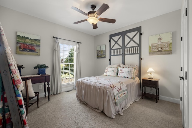 bedroom with baseboards, ceiling fan, and light colored carpet