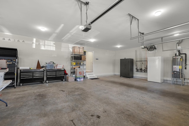 garage featuring baseboards, a garage door opener, gas water heater, and freestanding refrigerator