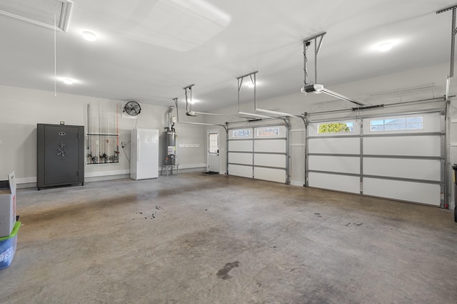 garage with water heater and baseboards