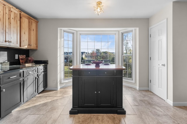 kitchen featuring a center island and light brown cabinetry