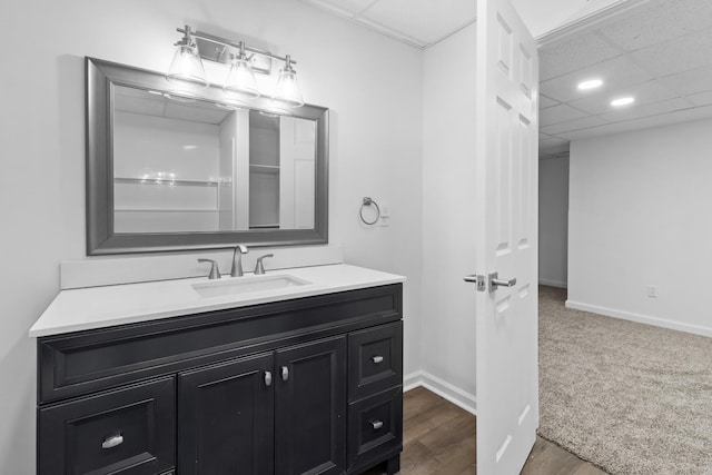 bathroom with vanity and a paneled ceiling