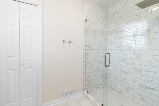 bathroom with a shower with shower door