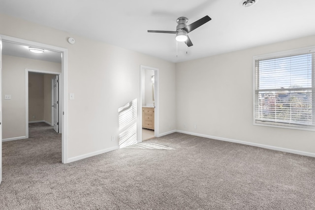 unfurnished bedroom with ceiling fan, connected bathroom, and light carpet