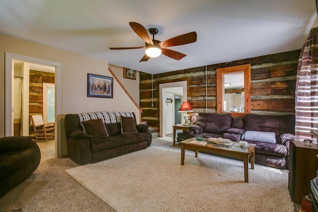 living room with light colored carpet and ceiling fan