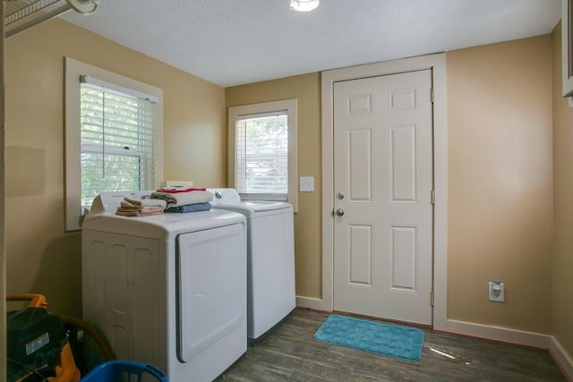 washroom featuring washer and dryer and dark wood-type flooring