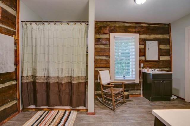 interior space with hardwood / wood-style flooring and sink