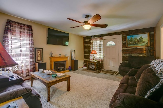 carpeted living room featuring ceiling fan